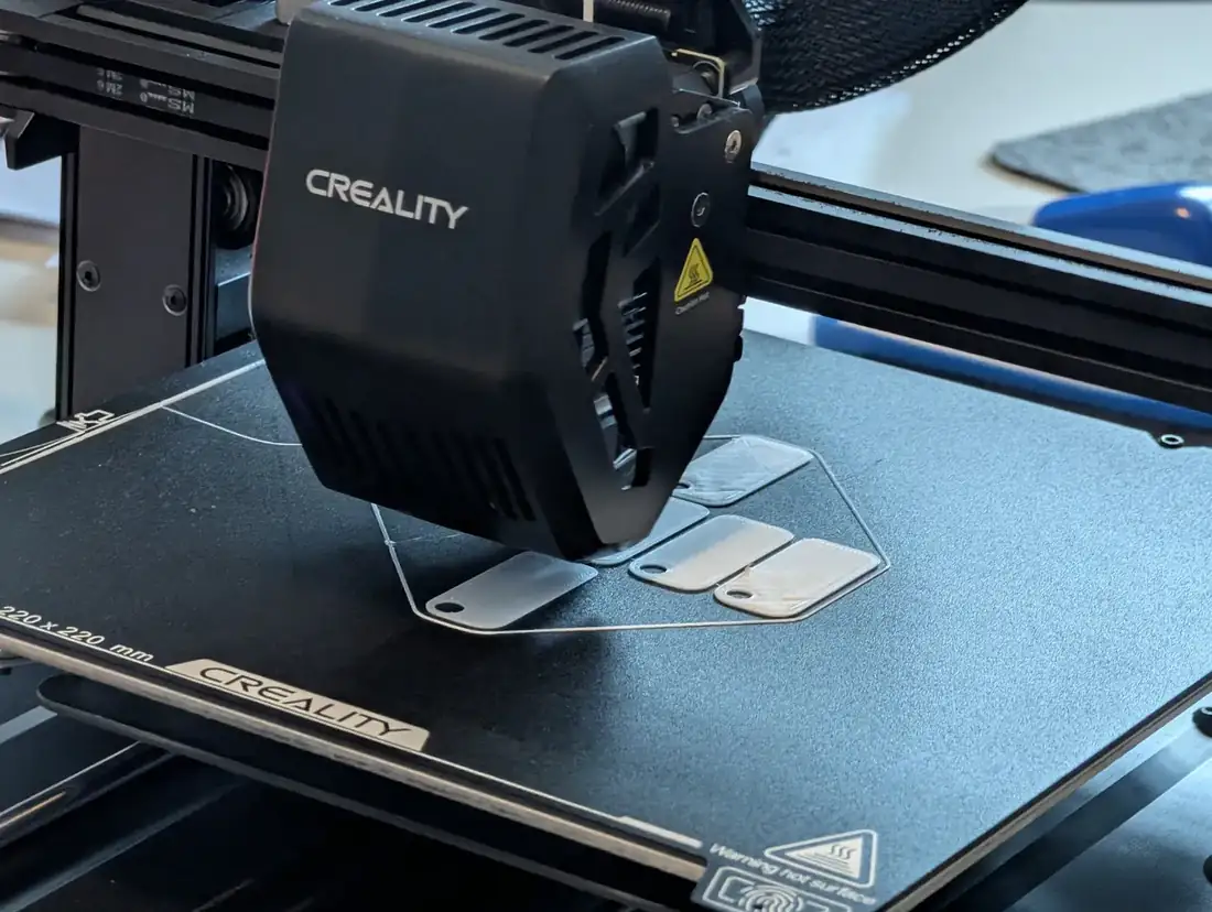 Parts being printed on the Nguzo Saba 3D printer bed